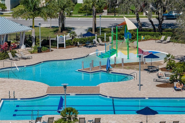 12808 Boggy Creek Dr, Riverview, FL 33579 - community pool featuring fence and a patio area