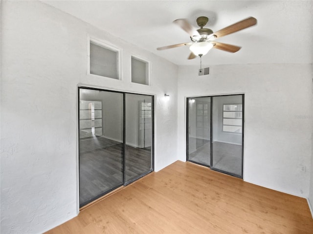 view of patio featuring a ceiling fan and visible vents