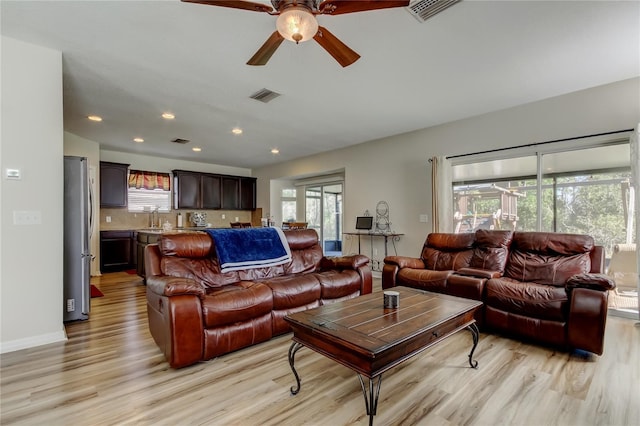 4250 Warwick Hills Dr, Wesley Chapel, FL 33543 - living area featuring light wood-style flooring, a ceiling fan, plenty of natural light, and recessed lighting