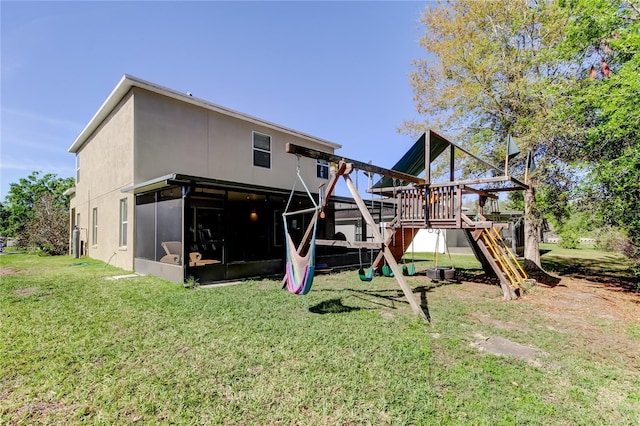 4250 Warwick Hills Dr, Wesley Chapel, FL 33543 - back of house with a playground and a yard