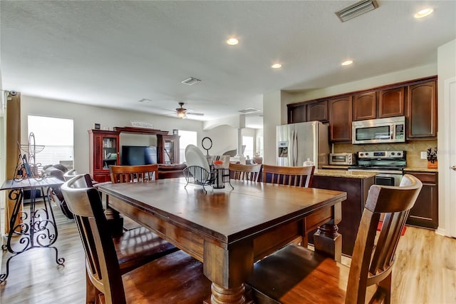 4250 Warwick Hills Dr, Wesley Chapel, FL 33543 - dining room with a ceiling fan, light wood-style flooring, ornate columns, and recessed lighting