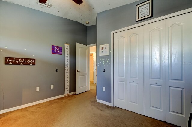 4250 Warwick Hills Dr, Wesley Chapel, FL 33543 - unfurnished bedroom with light carpet, baseboards, and a closet