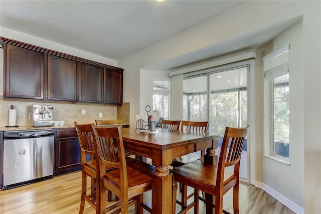 4250 Warwick Hills Dr, Wesley Chapel, FL 33543 - dining room with light wood-type flooring and baseboards