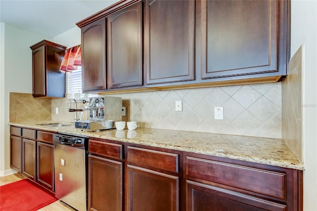 4250 Warwick Hills Dr, Wesley Chapel, FL 33543 - kitchen with dishwasher, a sink, light stone countertops, and tasteful backsplash