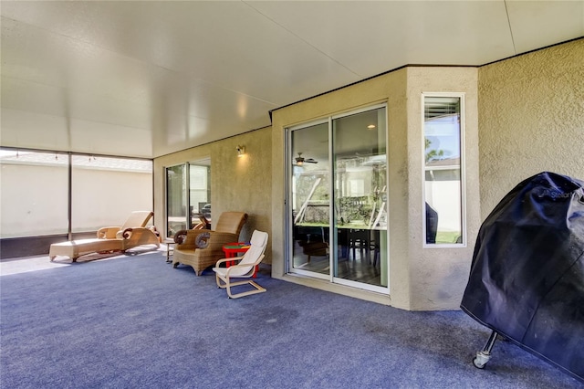 4250 Warwick Hills Dr, Wesley Chapel, FL 33543 - sunroom / solarium with a textured wall and carpet flooring
