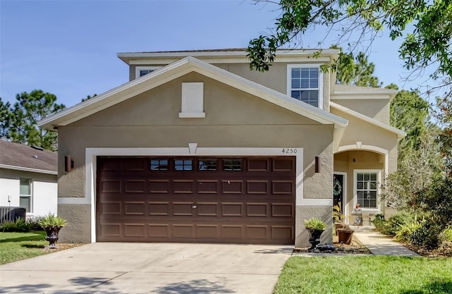 4250 Warwick Hills Dr, Wesley Chapel, FL 33543 - view of front of property with a garage, driveway, and stucco siding