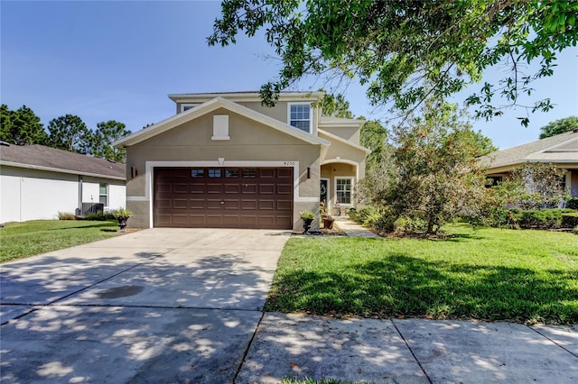 4250 Warwick Hills Dr, Wesley Chapel, FL 33543 - traditional-style home featuring stucco siding, a front lawn, an attached garage, and driveway