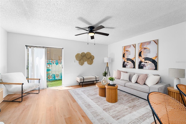 408 S Arrawana Ave Unit B4, Tampa, FL 33609 - living room with ceiling fan, wood finished floors, and a textured ceiling