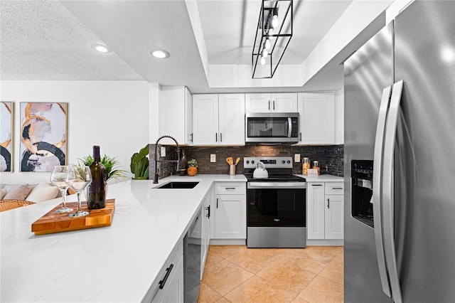 408 S Arrawana Ave Unit B4, Tampa, FL 33609 - kitchen featuring white cabinetry, recessed lighting, a sink, stainless steel appliances, and backsplash