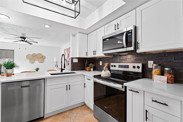 408 S Arrawana Ave Unit B4, Tampa, FL 33609 - kitchen featuring a sink, light countertops, a peninsula, and stainless steel appliances