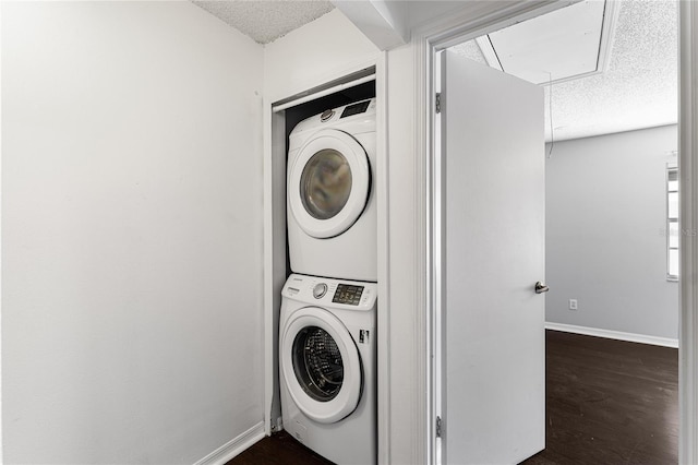 408 S Arrawana Ave Unit B4, Tampa, FL 33609 - washroom featuring attic access, stacked washer / dryer, laundry area, and a textured ceiling
