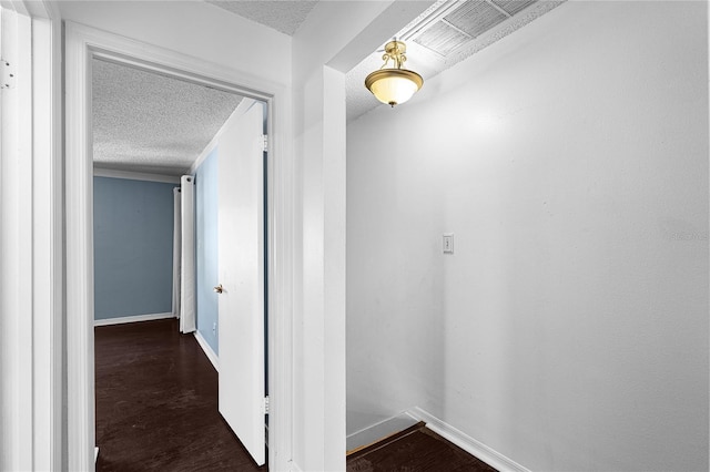 408 S Arrawana Ave Unit B4, Tampa, FL 33609 - corridor featuring dark wood-type flooring, baseboards, and a textured ceiling