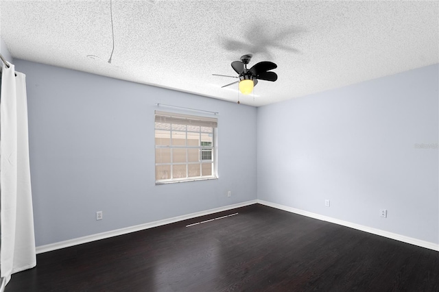 408 S Arrawana Ave Unit B4, Tampa, FL 33609 - spare room featuring a ceiling fan, baseboards, a textured ceiling, and dark wood finished floors