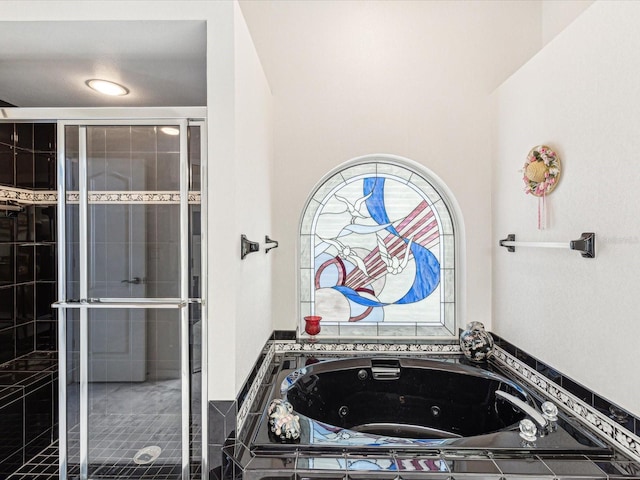 full bath featuring a shower stall and a jetted tub