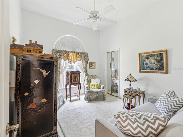 interior space featuring ceiling fan and carpet flooring
