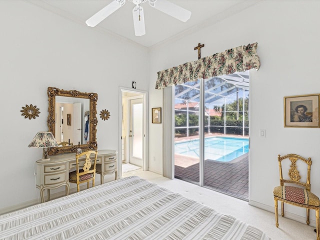 carpeted bedroom with access to exterior, ceiling fan, a high ceiling, and a sunroom