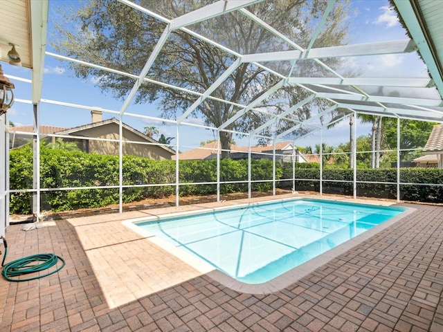 view of pool with a lanai, a patio, and a fenced in pool
