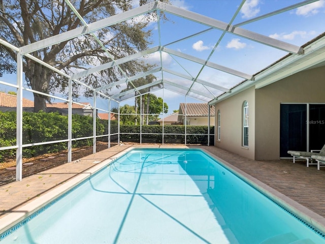 view of pool featuring a patio area, a fenced in pool, and a lanai