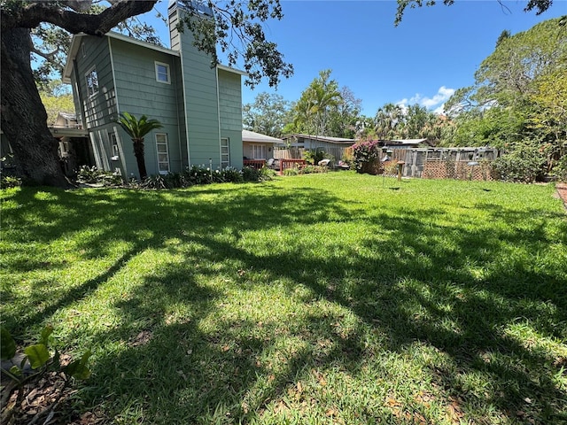 3316 S Shamrock Rd, Tampa, FL 33629 - view of green lawn featuring a deck