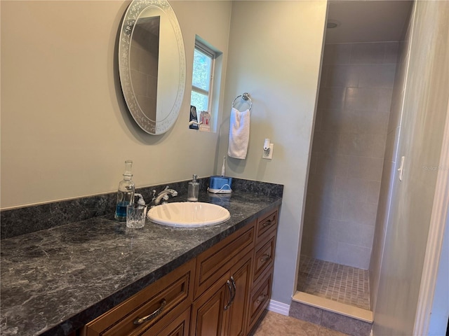 3316 S Shamrock Rd, Tampa, FL 33629 - bathroom featuring tiled shower, vanity, and tile patterned flooring
