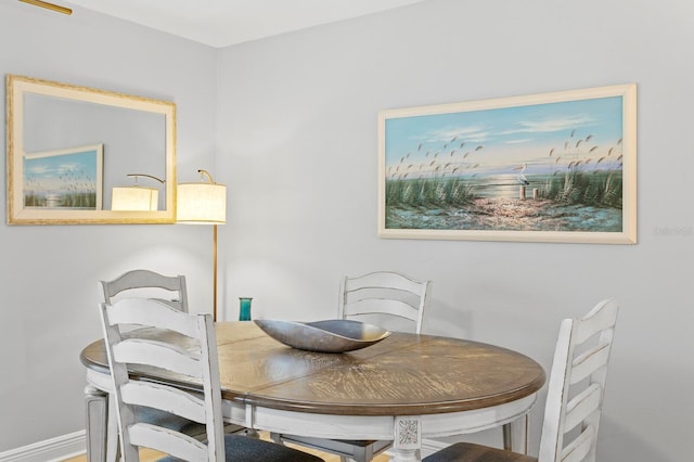 dining space featuring baseboards
