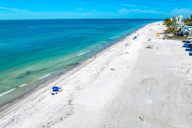 aerial view featuring a view of the beach and a water view