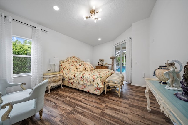 8833 Bel Meadow Way, Trinity, FL 34655 - bedroom featuring wood finished floors, access to outside, a textured ceiling, a chandelier, and vaulted ceiling