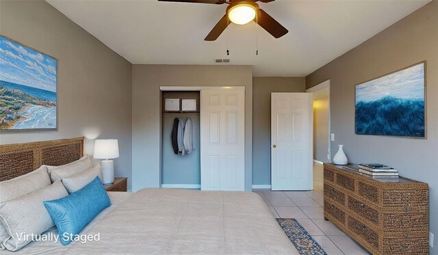 bedroom featuring light tile patterned floors, a ceiling fan, visible vents, baseboards, and a closet