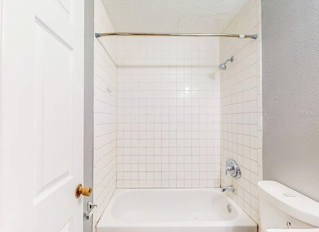 full bath with a textured wall, a textured ceiling, shower / bathtub combination, and toilet