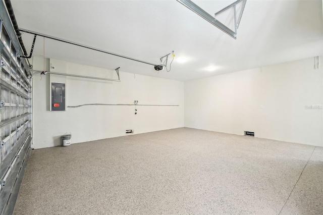 4559 Mitcher Rd, New Port Richey, FL 34652 - garage featuring electric panel and a garage door opener