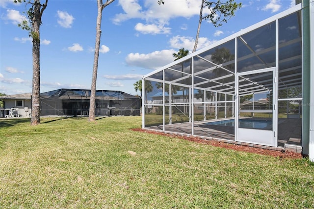 4559 Mitcher Rd, New Port Richey, FL 34652 - view of grassy yard with a lanai and an outdoor pool