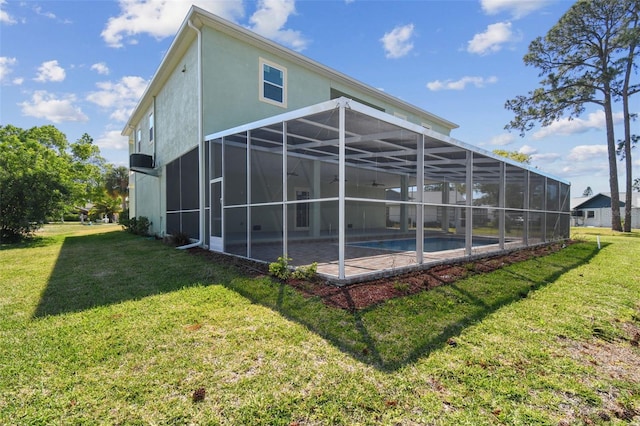 4559 Mitcher Rd, New Port Richey, FL 34652 - back of property with a yard, a patio area, an outdoor pool, and stucco siding