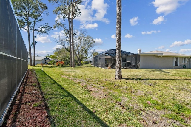 4559 Mitcher Rd, New Port Richey, FL 34652 - view of green lawn featuring glass enclosure