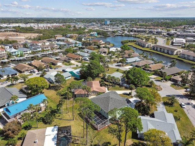4559 Mitcher Rd, New Port Richey, FL 34652 - aerial perspective of suburban area with a large body of water