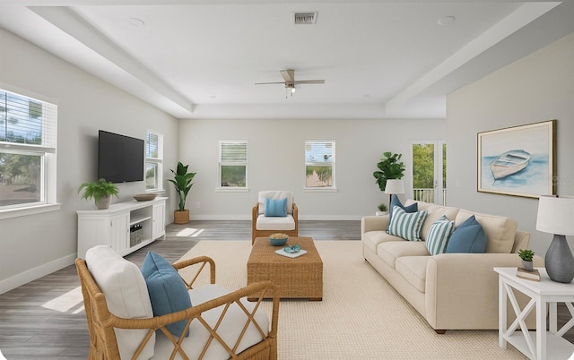 4559 Mitcher Rd, New Port Richey, FL 34652 - living room with ceiling fan, wood finished floors, and a raised ceiling