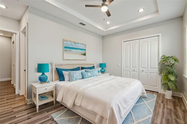 4559 Mitcher Rd, New Port Richey, FL 34652 - bedroom featuring wood finished floors, recessed lighting, a closet, ceiling fan, and a raised ceiling