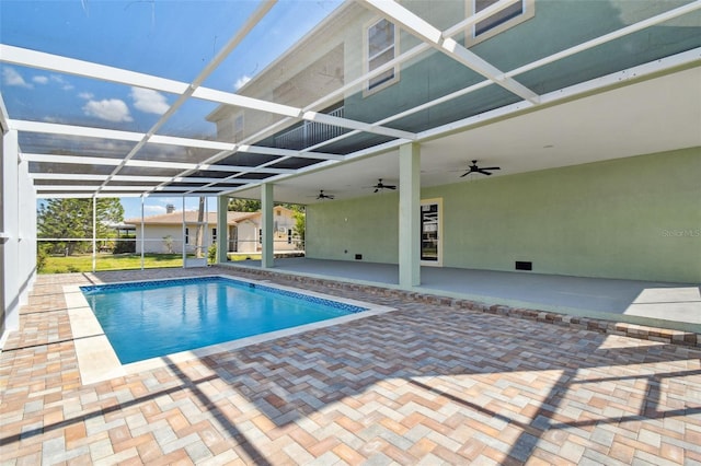 4559 Mitcher Rd, New Port Richey, FL 34652 - swimming pool with a patio, ceiling fan, and a lanai