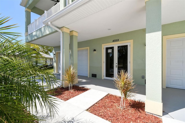 4559 Mitcher Rd, New Port Richey, FL 34652 - entrance to property featuring stucco siding and french doors