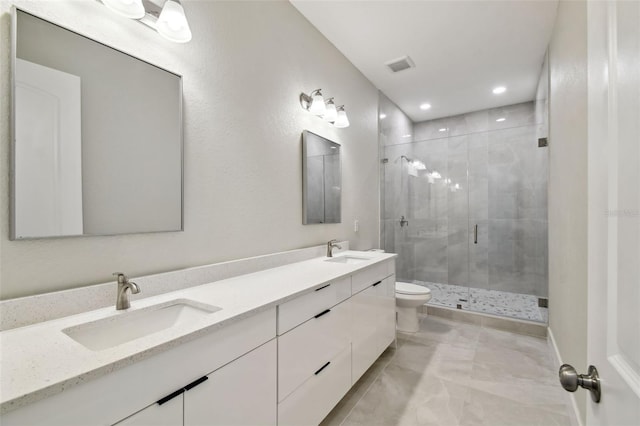 4559 Mitcher Rd, New Port Richey, FL 34652 - bathroom with double vanity, a stall shower, marble finish flooring, and recessed lighting