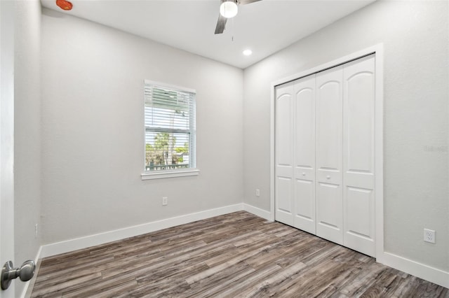 4559 Mitcher Rd, New Port Richey, FL 34652 - unfurnished bedroom with wood finished floors, a closet, recessed lighting, and ceiling fan