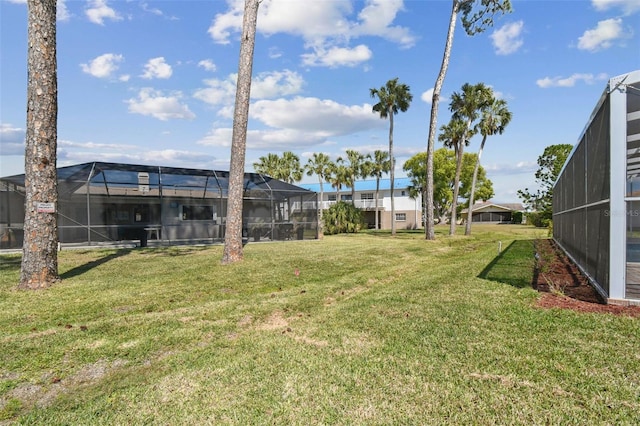 4559 Mitcher Rd, New Port Richey, FL 34652 - view of grassy yard featuring glass enclosure