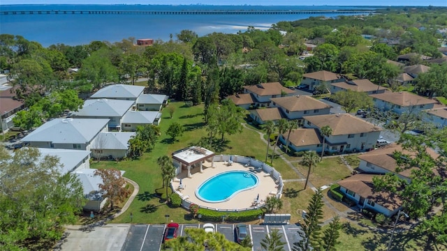 bird's eye view with a water view and a residential view