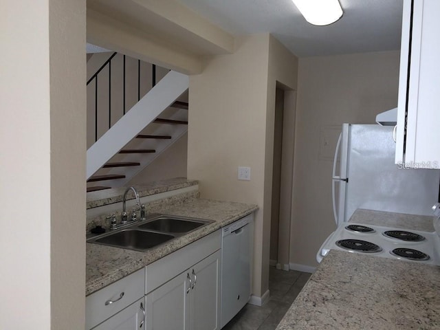 1830 Bough Ave Unit 2, Clearwater, FL 33760 - kitchen with white appliances, white cabinets, light tile patterned flooring, ventilation hood, and light stone countertops