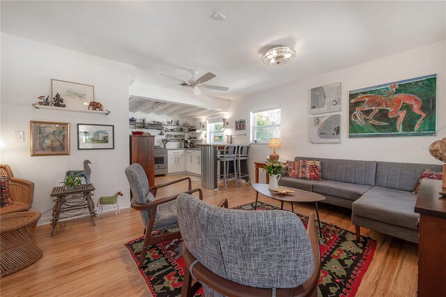 604 W Hilda St, Tampa, FL 33603 - living room with light wood-style flooring and a ceiling fan