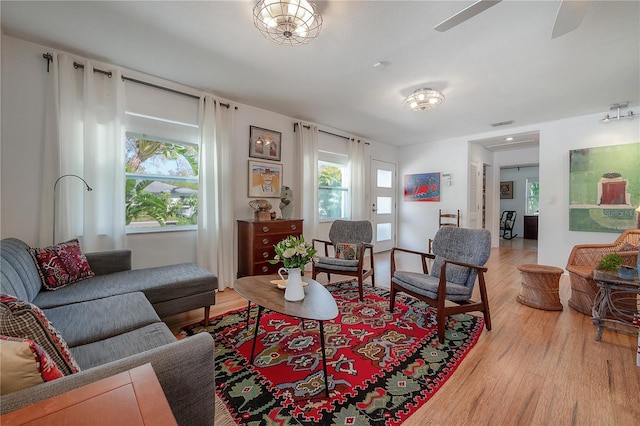 604 W Hilda St, Tampa, FL 33603 - living area featuring light wood-style floors, plenty of natural light, and a ceiling fan