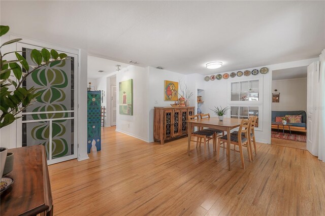 604 W Hilda St, Tampa, FL 33603 - dining area with light wood finished floors and baseboards