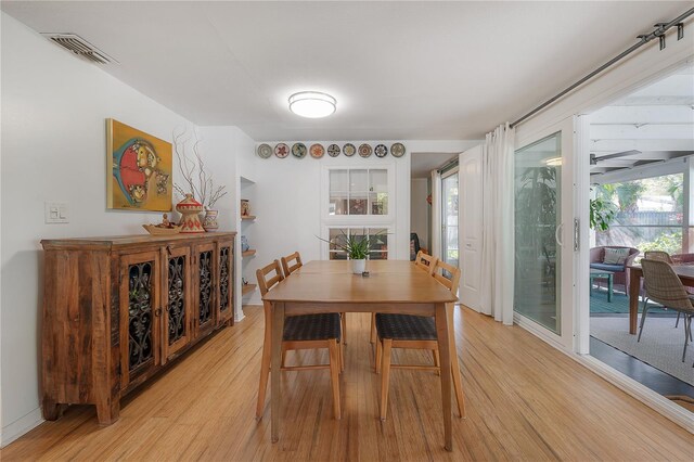 604 W Hilda St, Tampa, FL 33603 - dining room featuring light wood finished floors