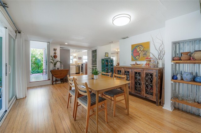 604 W Hilda St, Tampa, FL 33603 - dining room featuring light wood finished floors