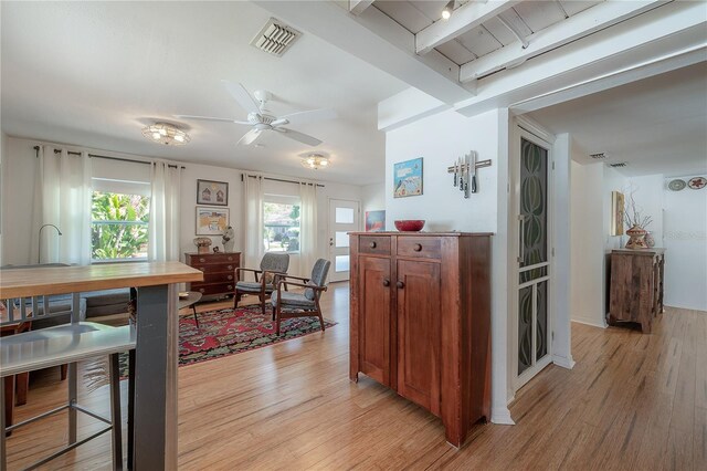 604 W Hilda St, Tampa, FL 33603 - hallway featuring light wood-style floors and beam ceiling