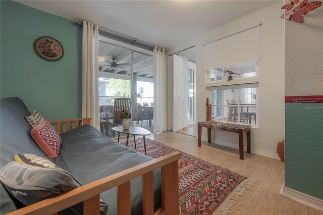 604 W Hilda St, Tampa, FL 33603 - living area with ceiling fan, wood finished floors, and baseboards